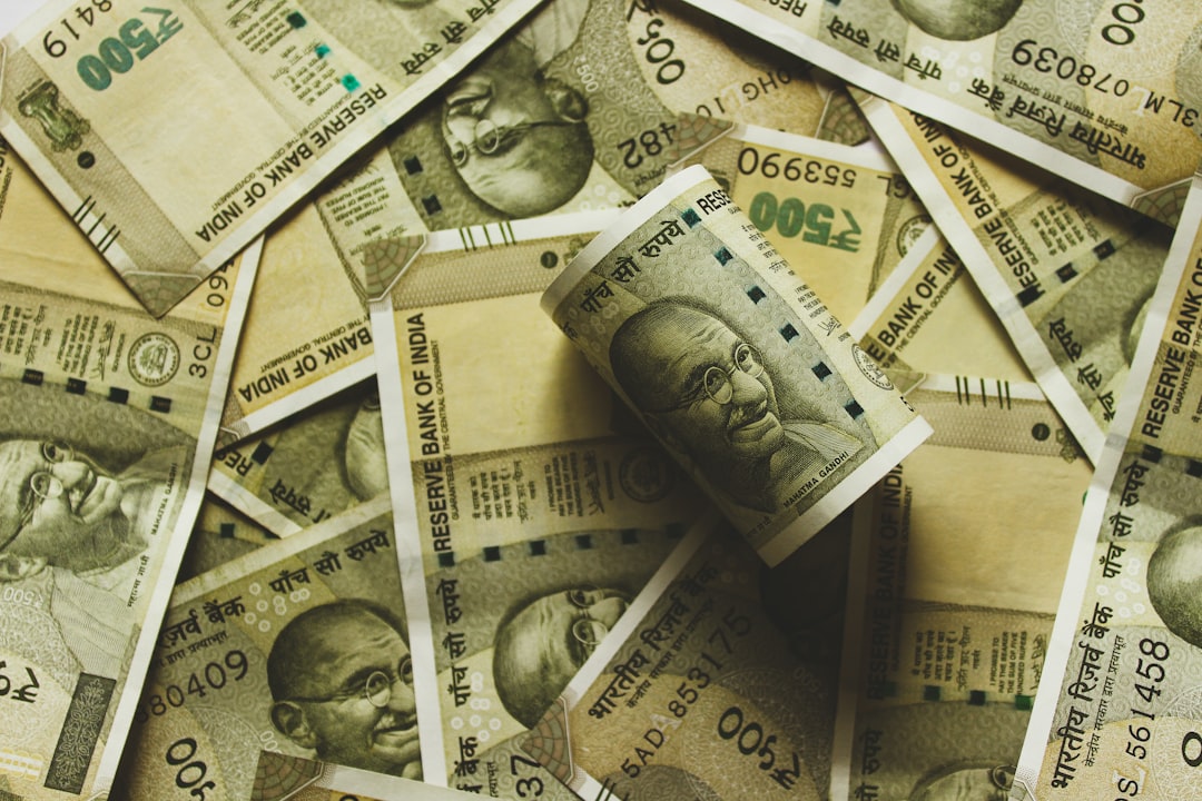 Placeholder - A graphic showing a piggy bank with a small stack of cash next to it, symbolizing 'Maintain Cash Reserves'. Alt text: "Maintain cash reserves during market volatility to capitalize on future buying opportunities."